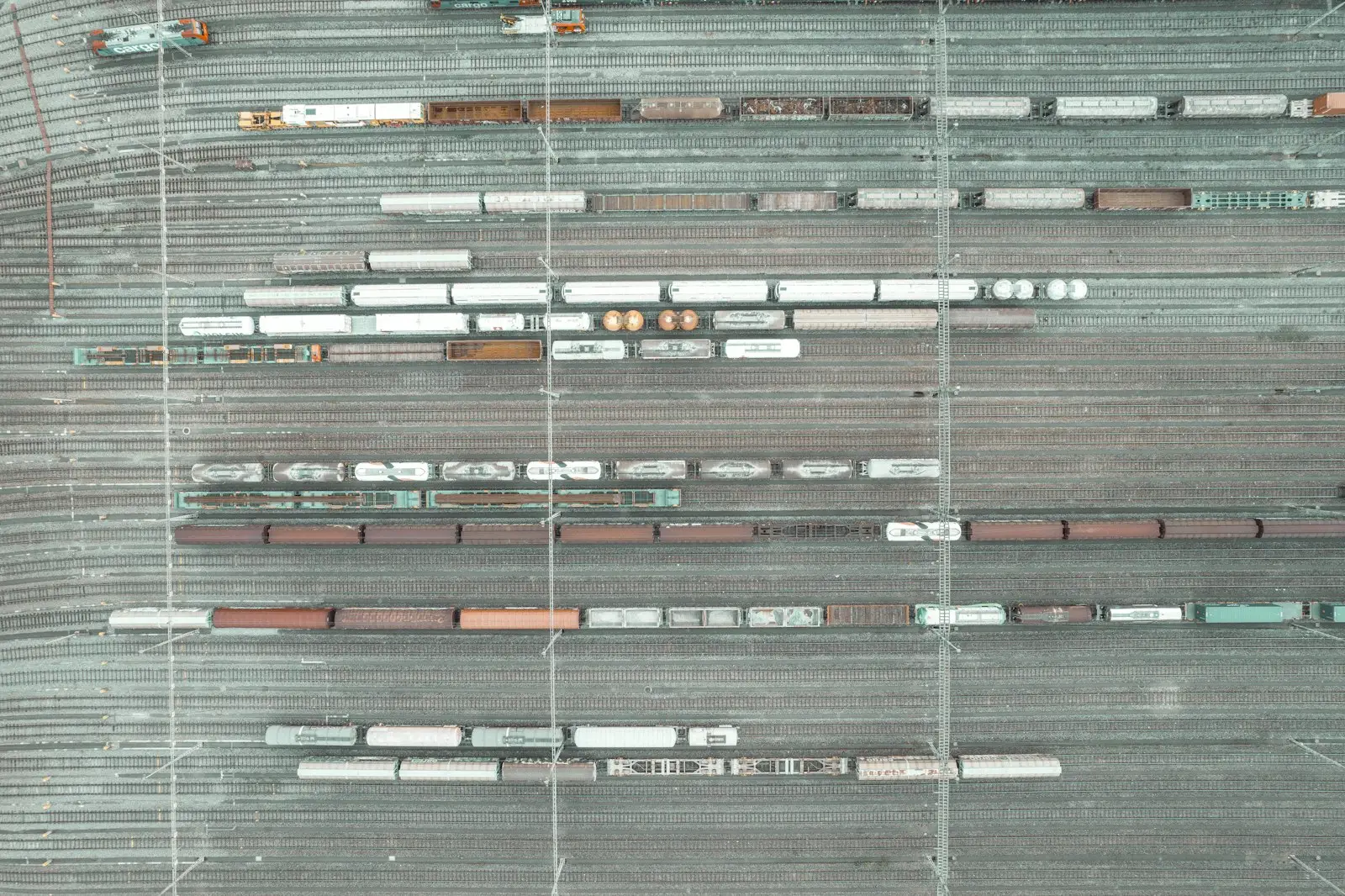 An aerial view of a parking lot with cars parked in it