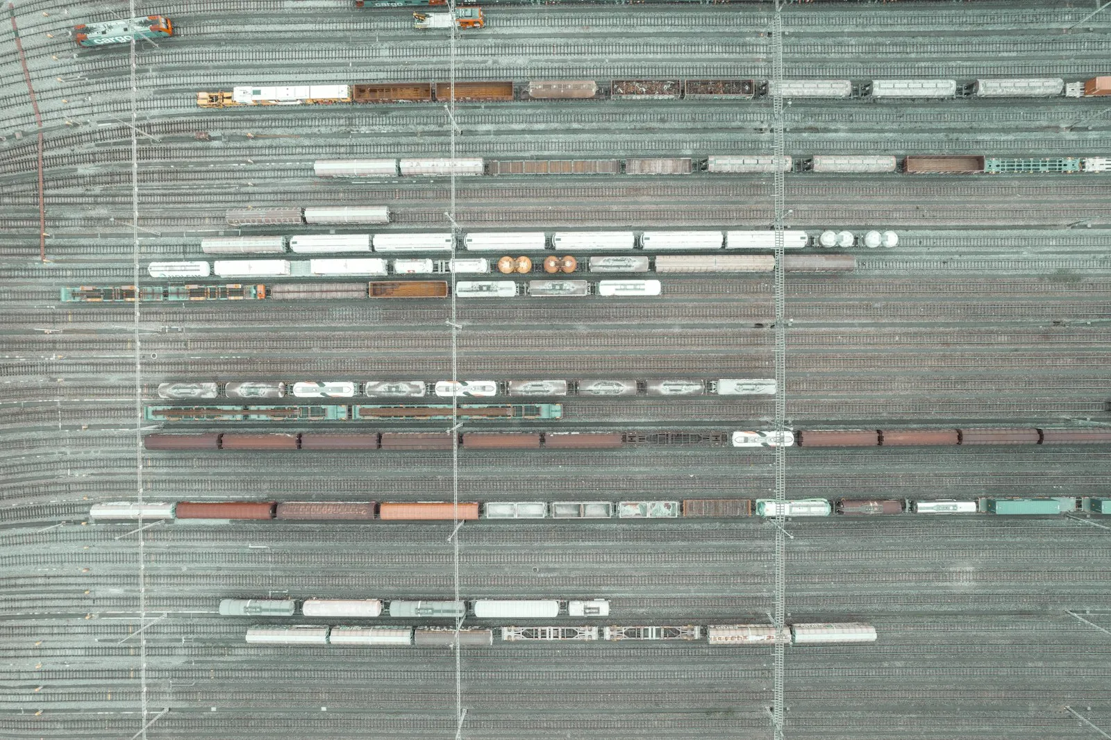An aerial view of a parking lot with cars parked in it