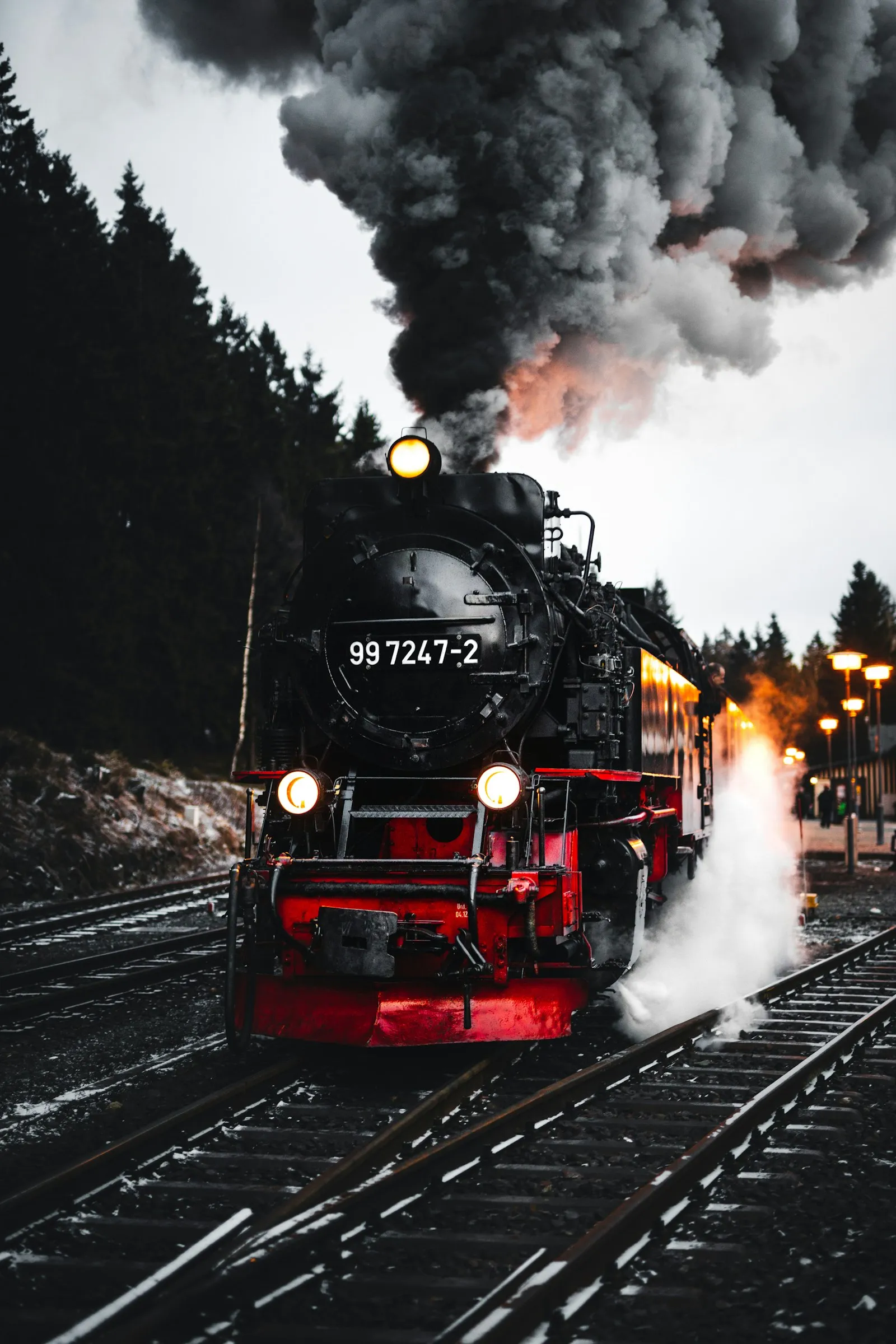 Red-and-black locomotive on the rails — the kind of freight power that carries the 149 dB Nathan K5 chord