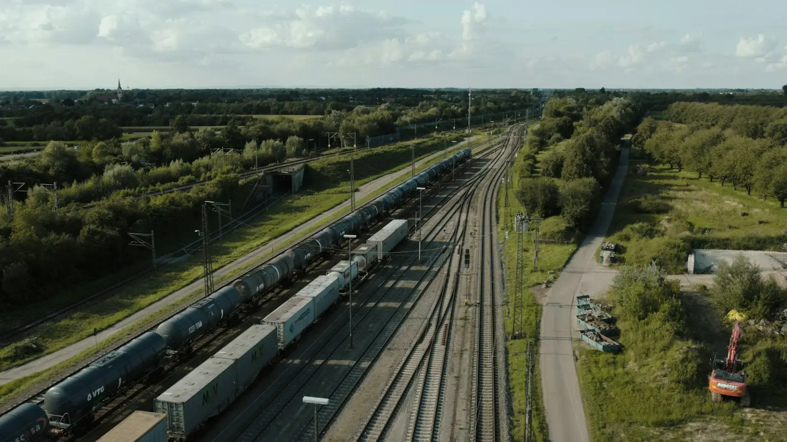 A train traveling through a lush green countryside