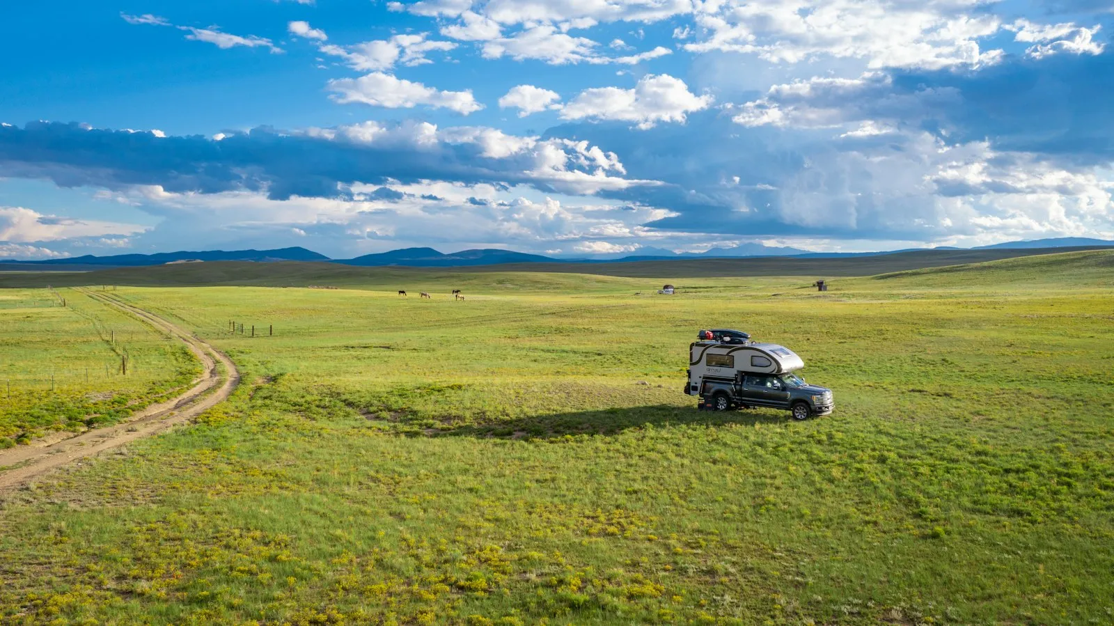 Silver Chevrolet Colorado on a dirt road — mid-size Colorado pickup install context