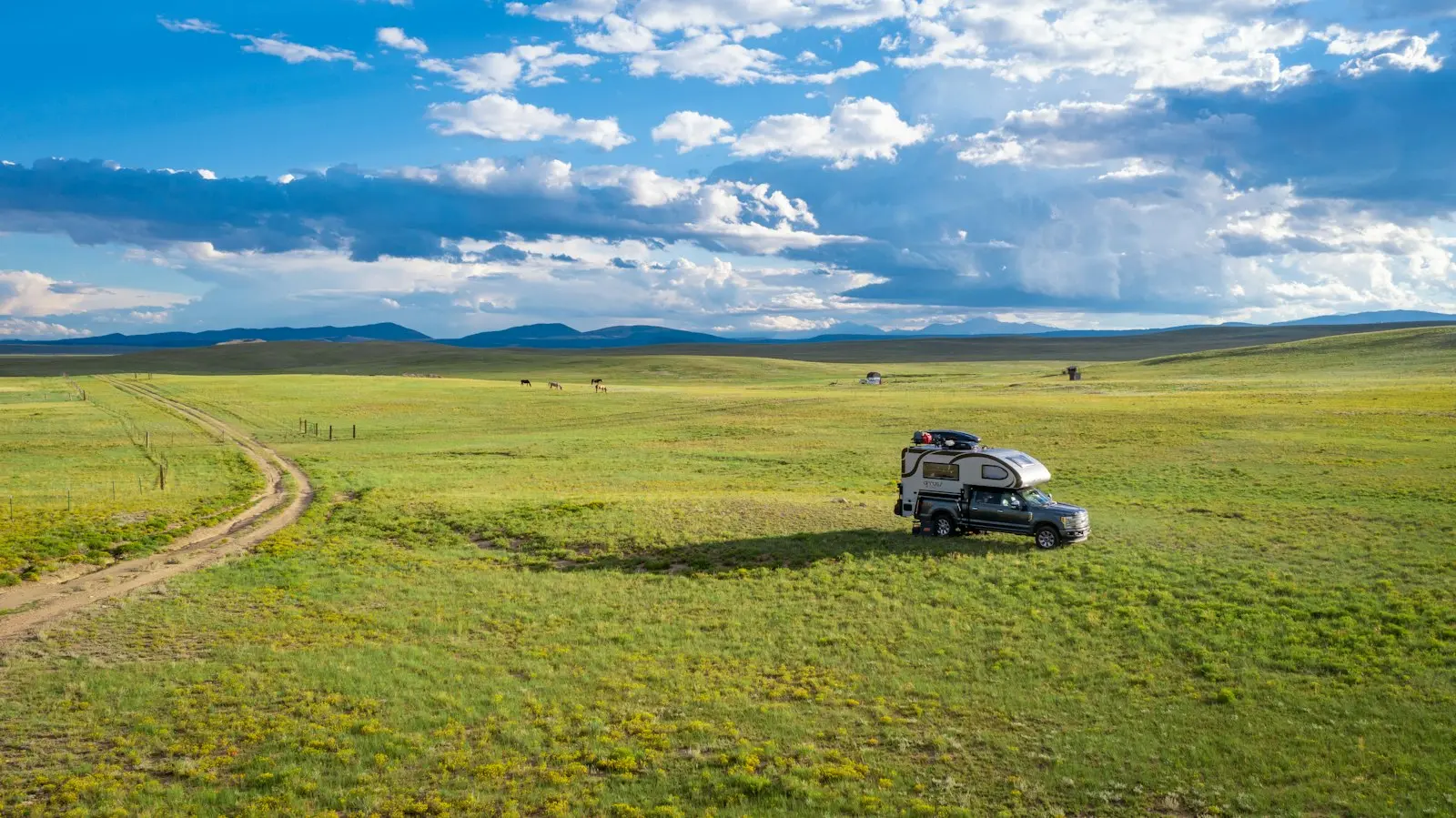 Silver Chevrolet Colorado on a dirt road — mid-size Colorado pickup install context