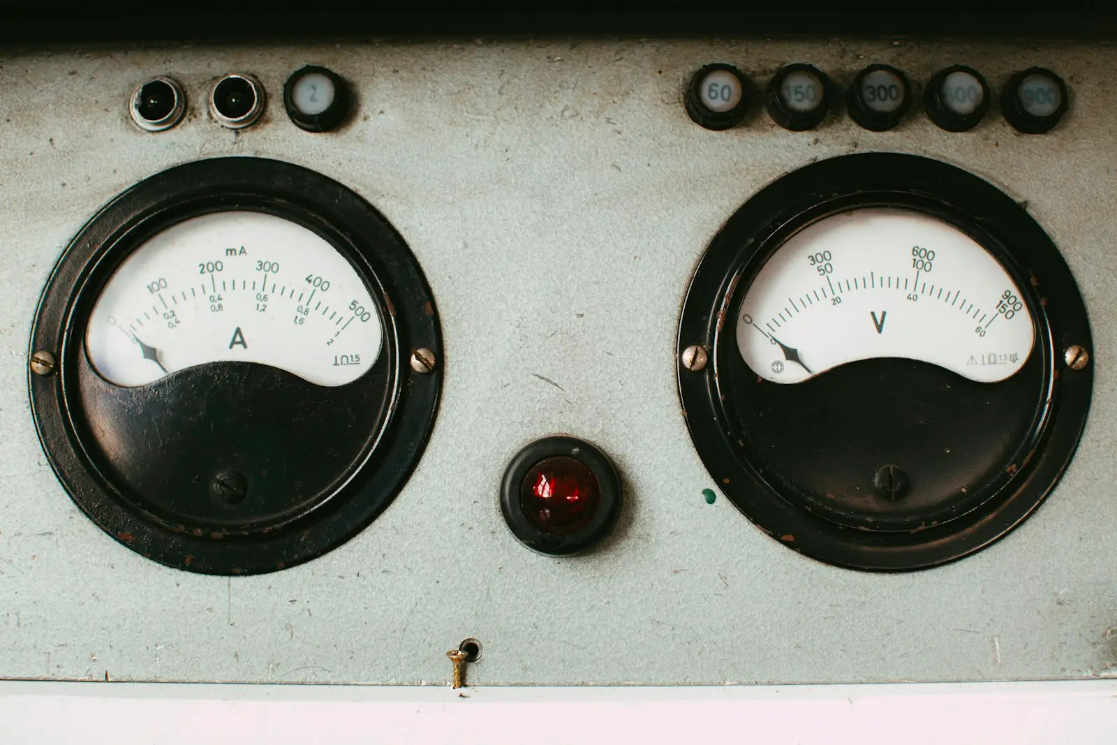 Black and white analog gauge — a decibel meter measuring sound pressure level