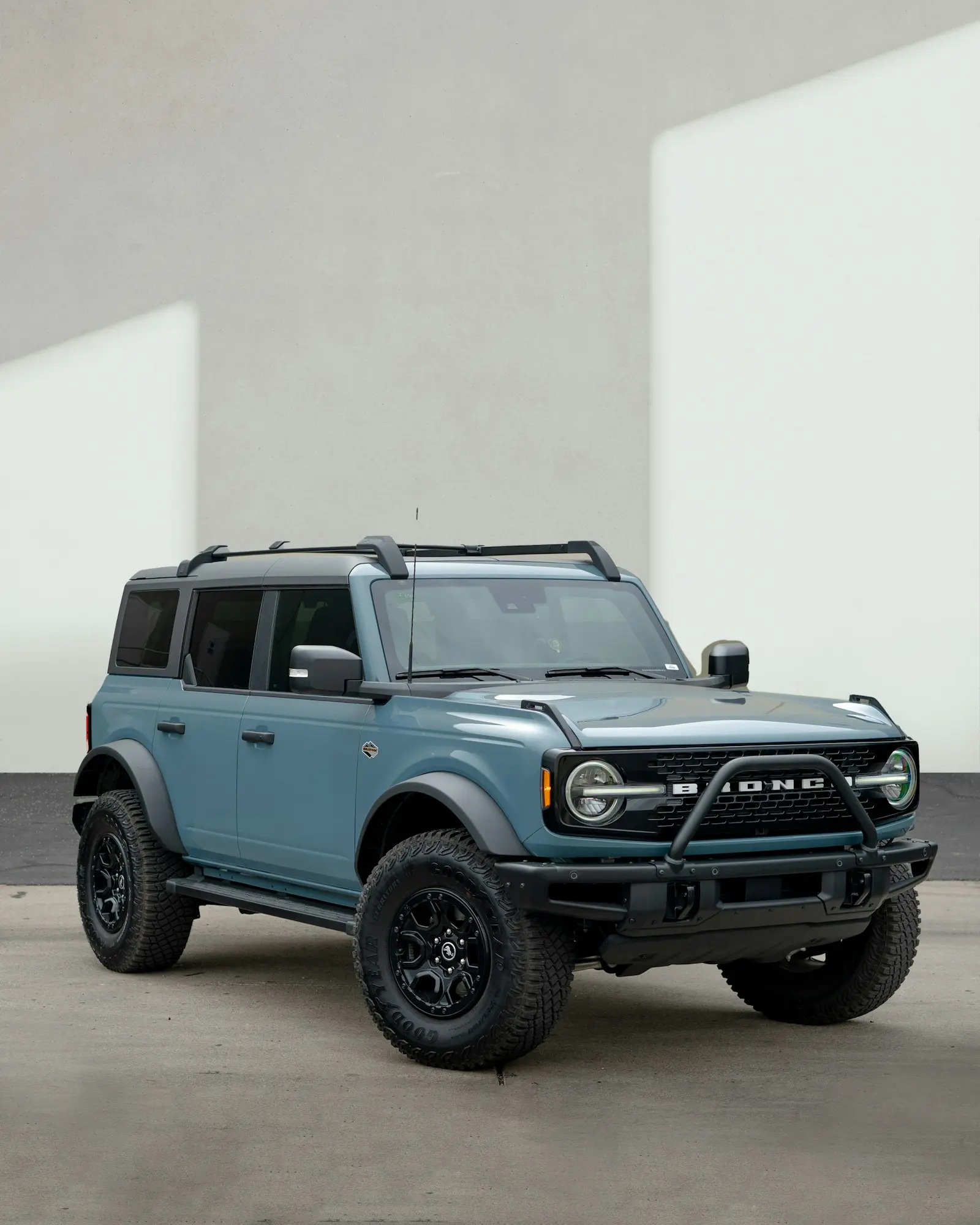 Blue Ford Bronco in a parking lot — Bronco off-road SUV install context