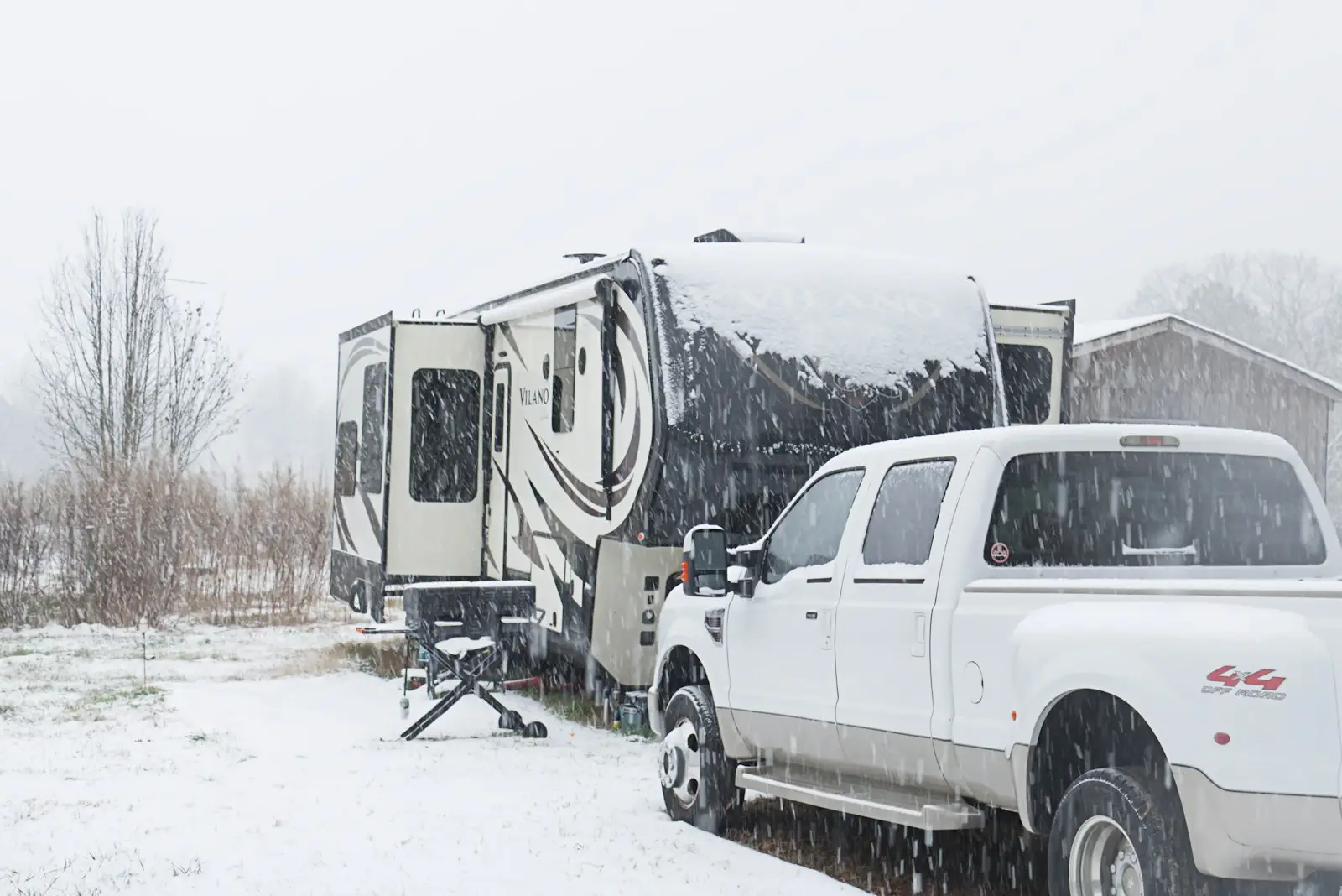 Pickup truck and 5th wheel RV in the snow.