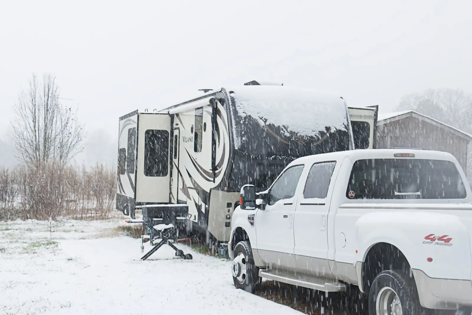 Pickup truck and 5th wheel RV in the snow.