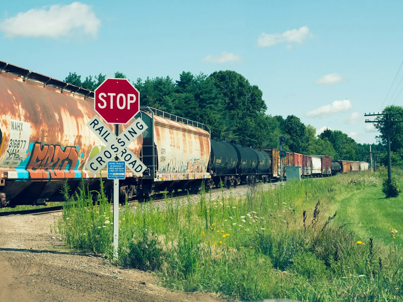 Red and white train on rail tracks during daytime