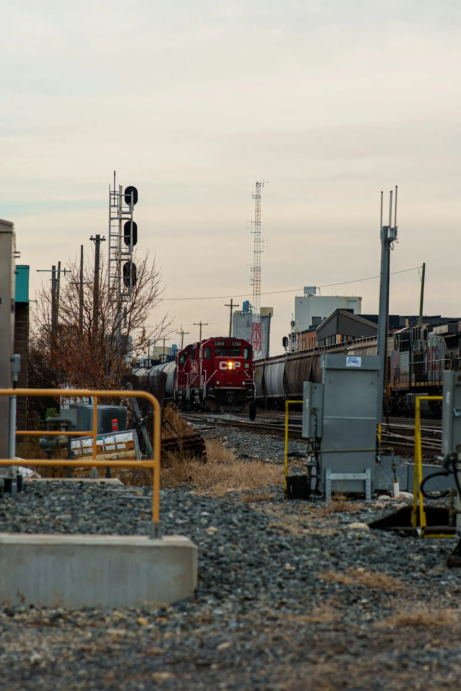 Red freight locomotive pulling cars — the kind of switcher / short-line power where the K3LA appears today
