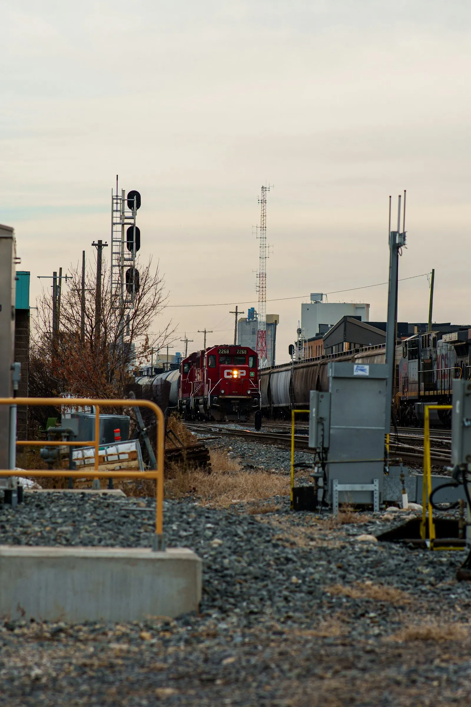 Red freight locomotive pulling cars — the kind of switcher / short-line power where the K3LA appears today