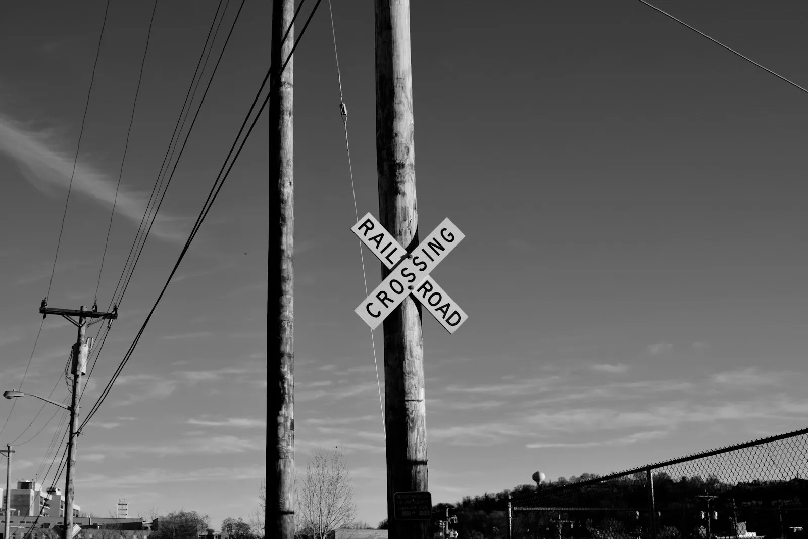 Grayscale photo of street sign
