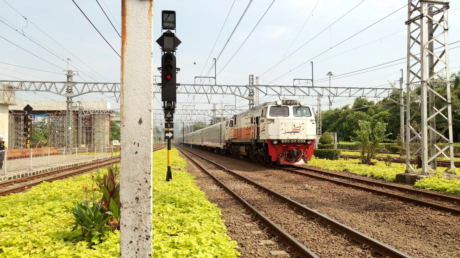A Train with CC 206 Locomotive passing by Manggarai Station