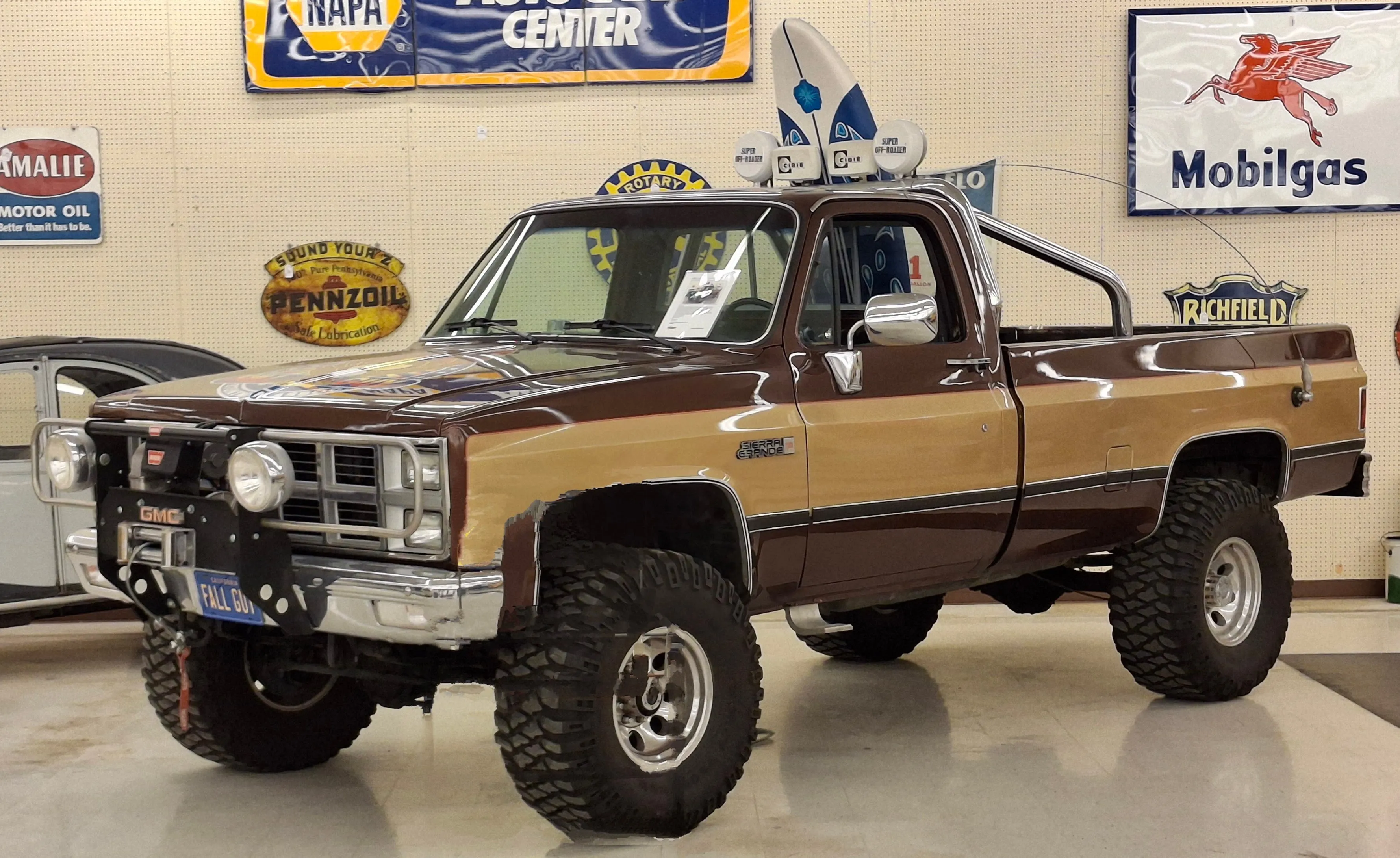 Lifted GMC pickup truck of the kind owners fit with aftermarket triple-trumpet train horns