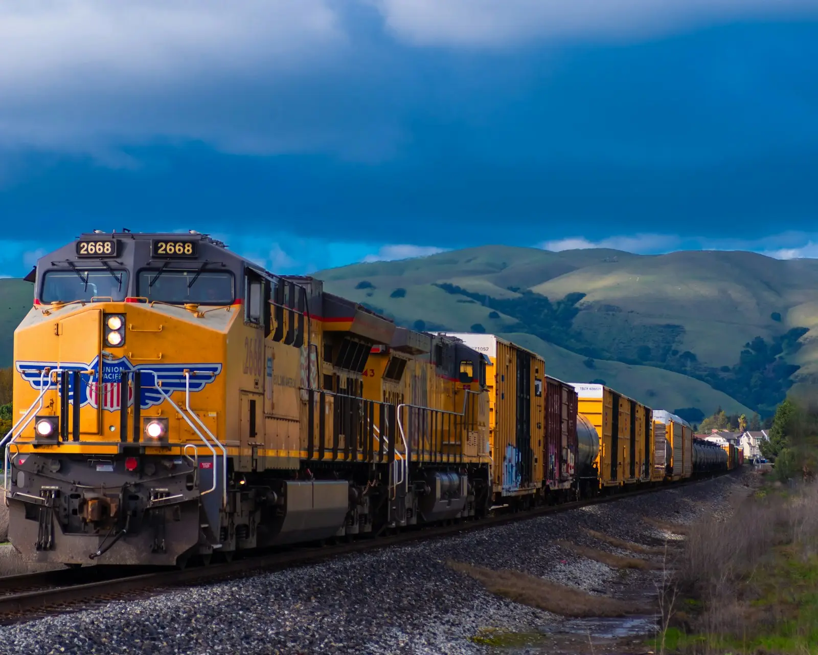 I loved the analagous colors formed by the yellow train, green hills, and blue sky. I love the country feel this photo has with the rolling green hills in the b