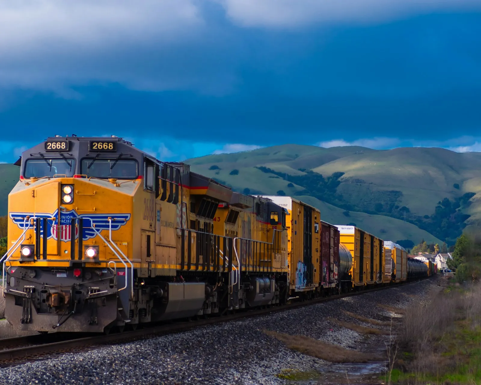 I loved the analagous colors formed by the yellow train, green hills, and blue sky. I love the country feel this photo has with the rolling green hills in the b