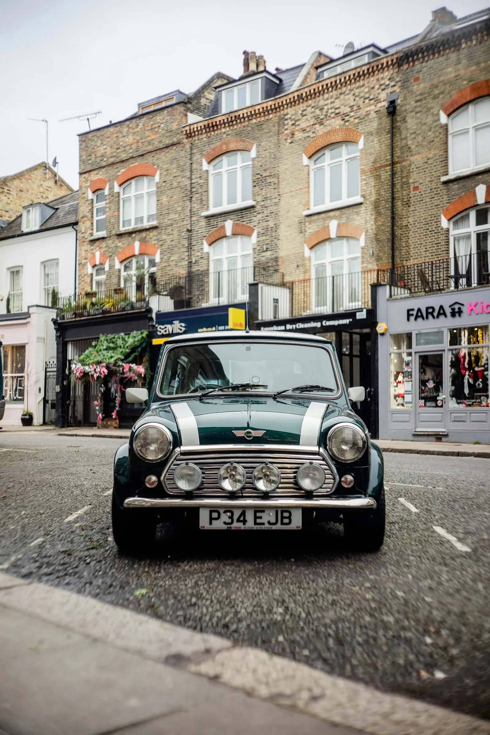 Green Mini Cooper on the road — Mini Cooper install context