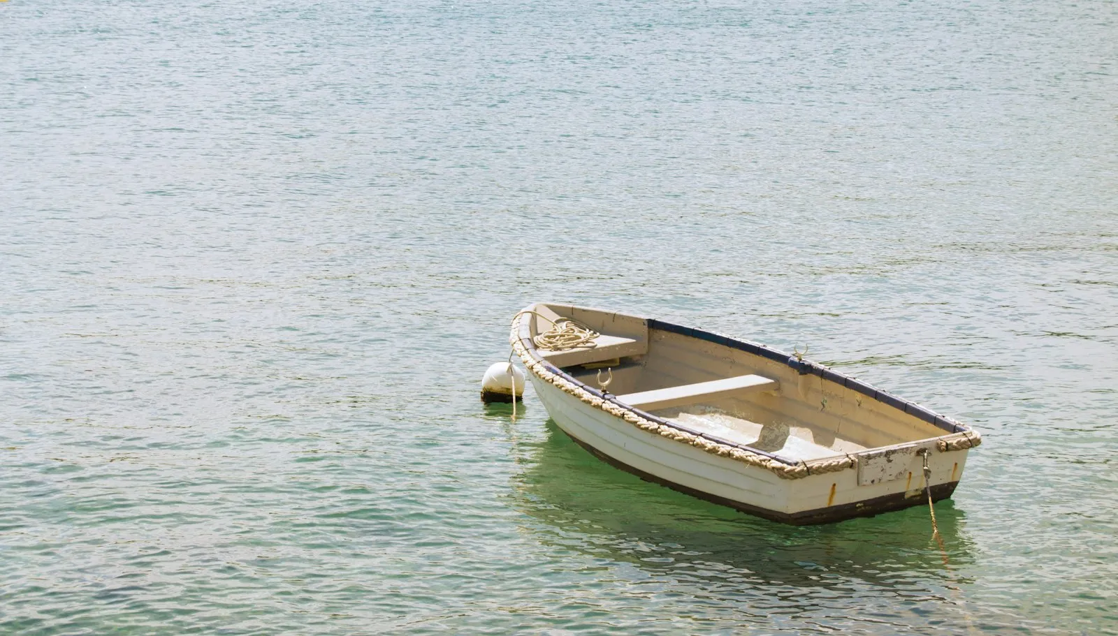 A lonely boat lies in the harbor of Rovinj, Croatia.