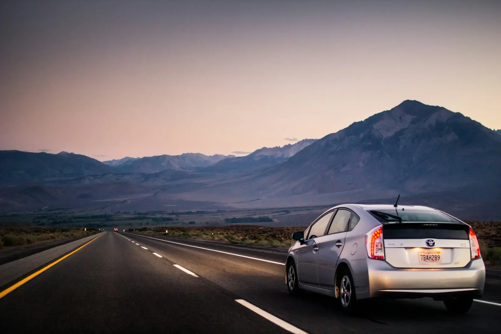 Toyota Prius hybrid driving on an empty road — Prius install context