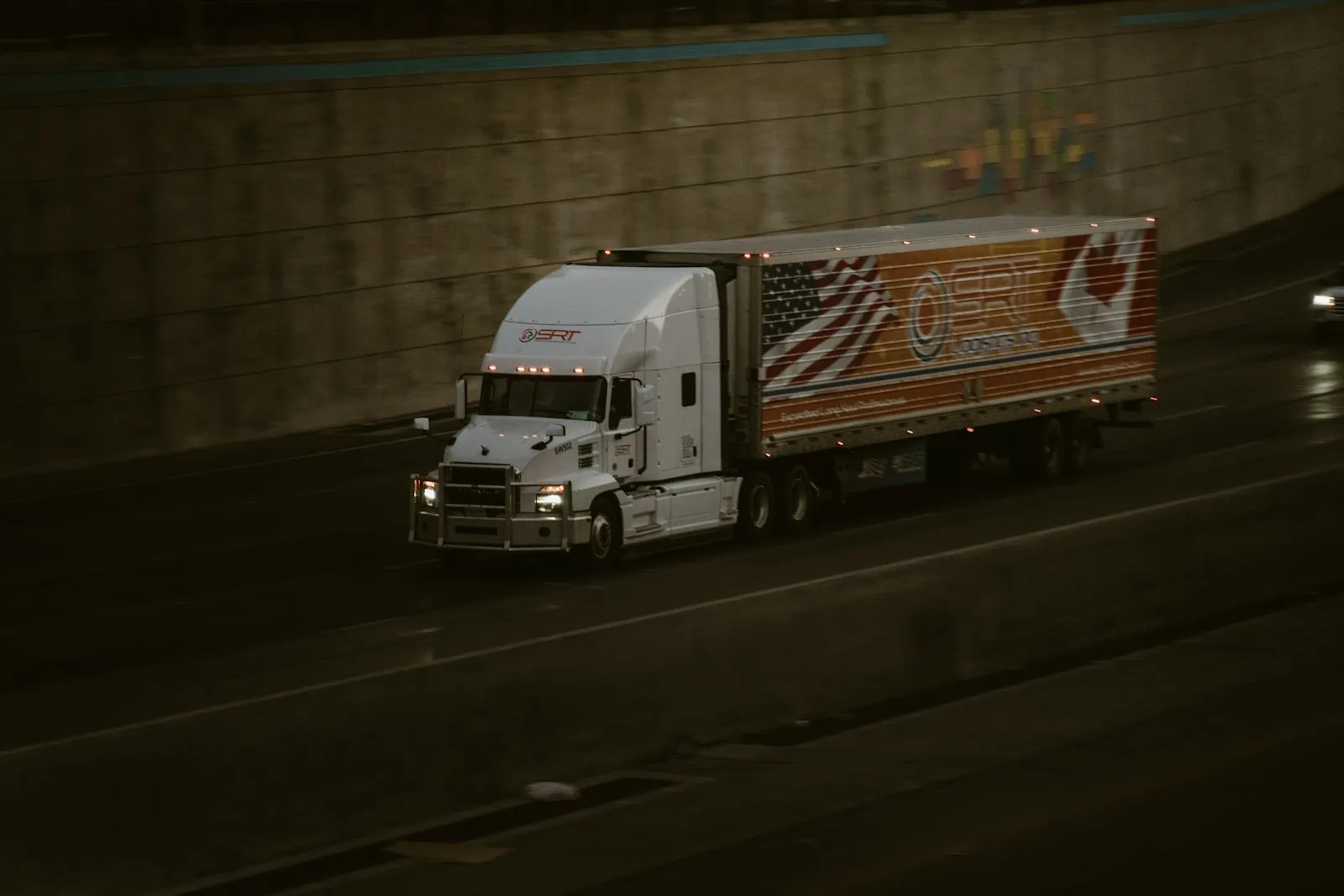 Pink semi-truck with chrome exhaust pipes — generic Class 8 semi-truck install context