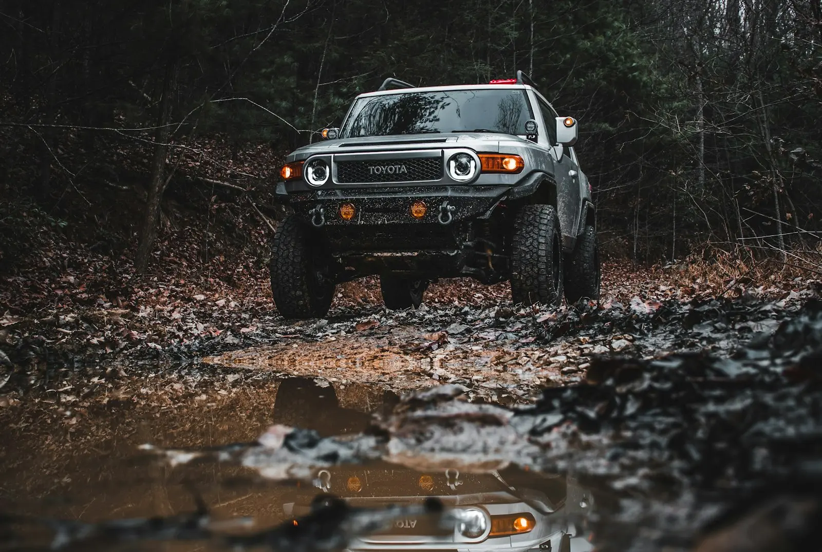 Toyota FJ Cruiser driving through mud — FJ Cruiser install context