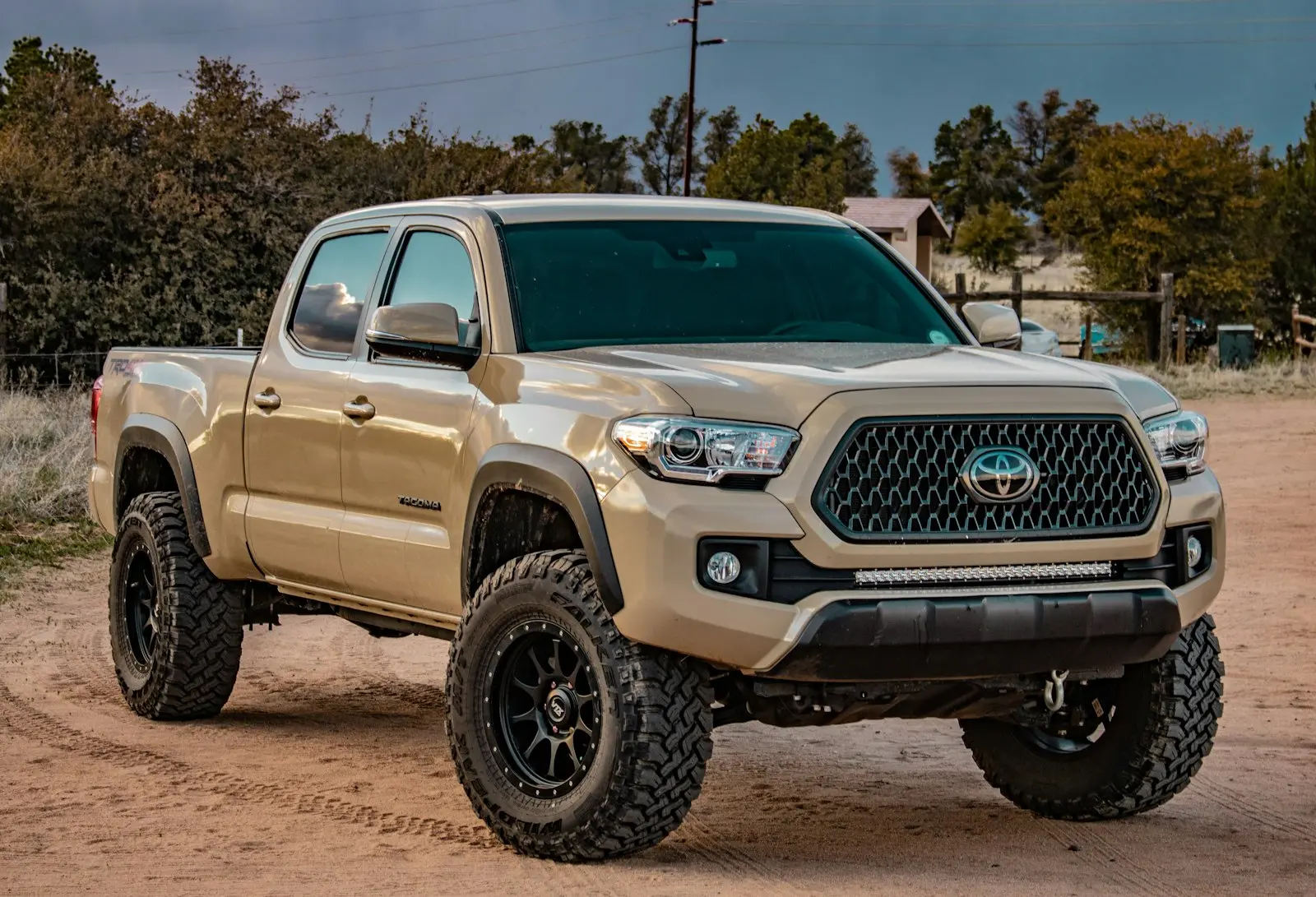 White Toyota Tacoma crew cab pickup — Tacoma mid-size install context