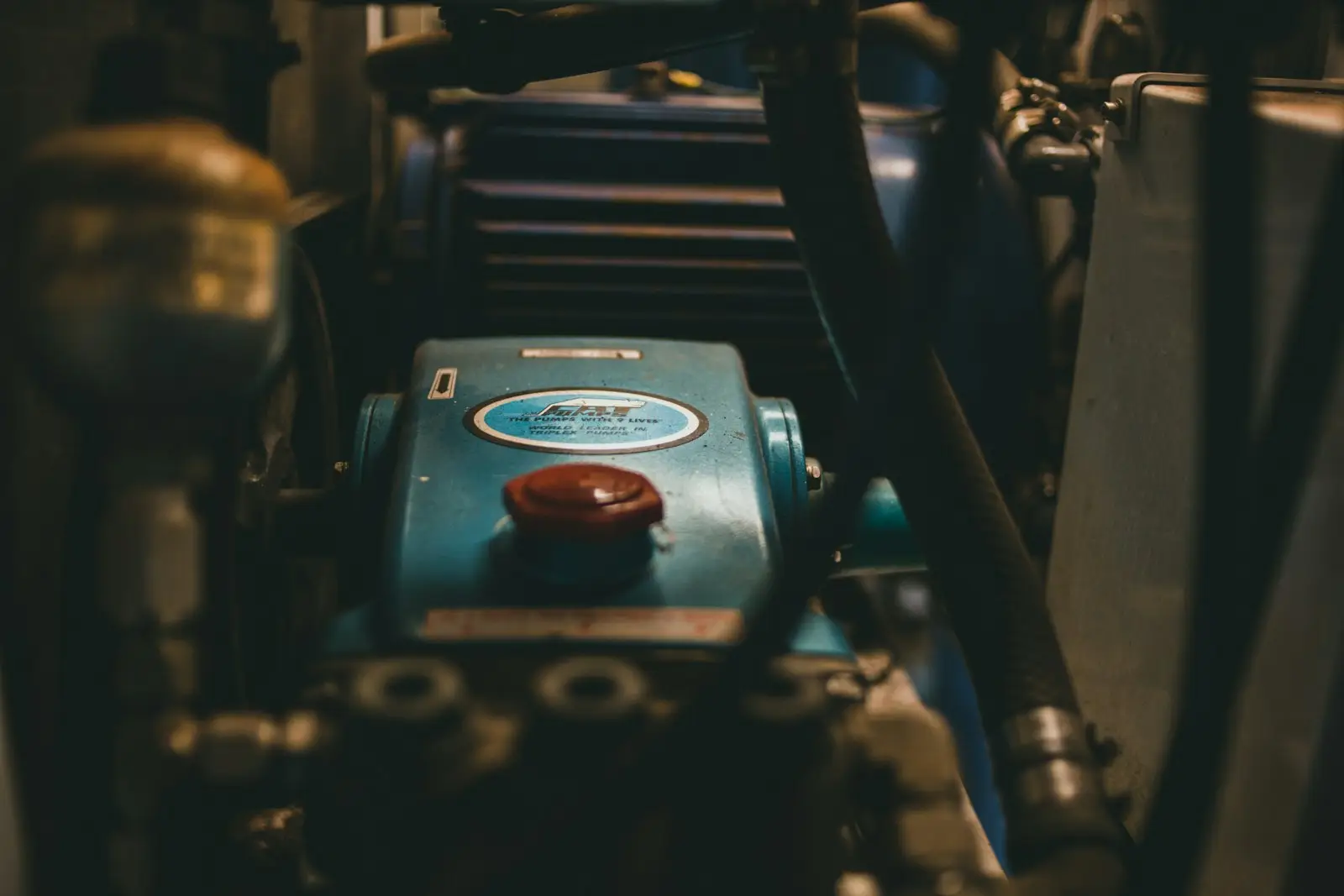 A close up of a machine with a red button on it