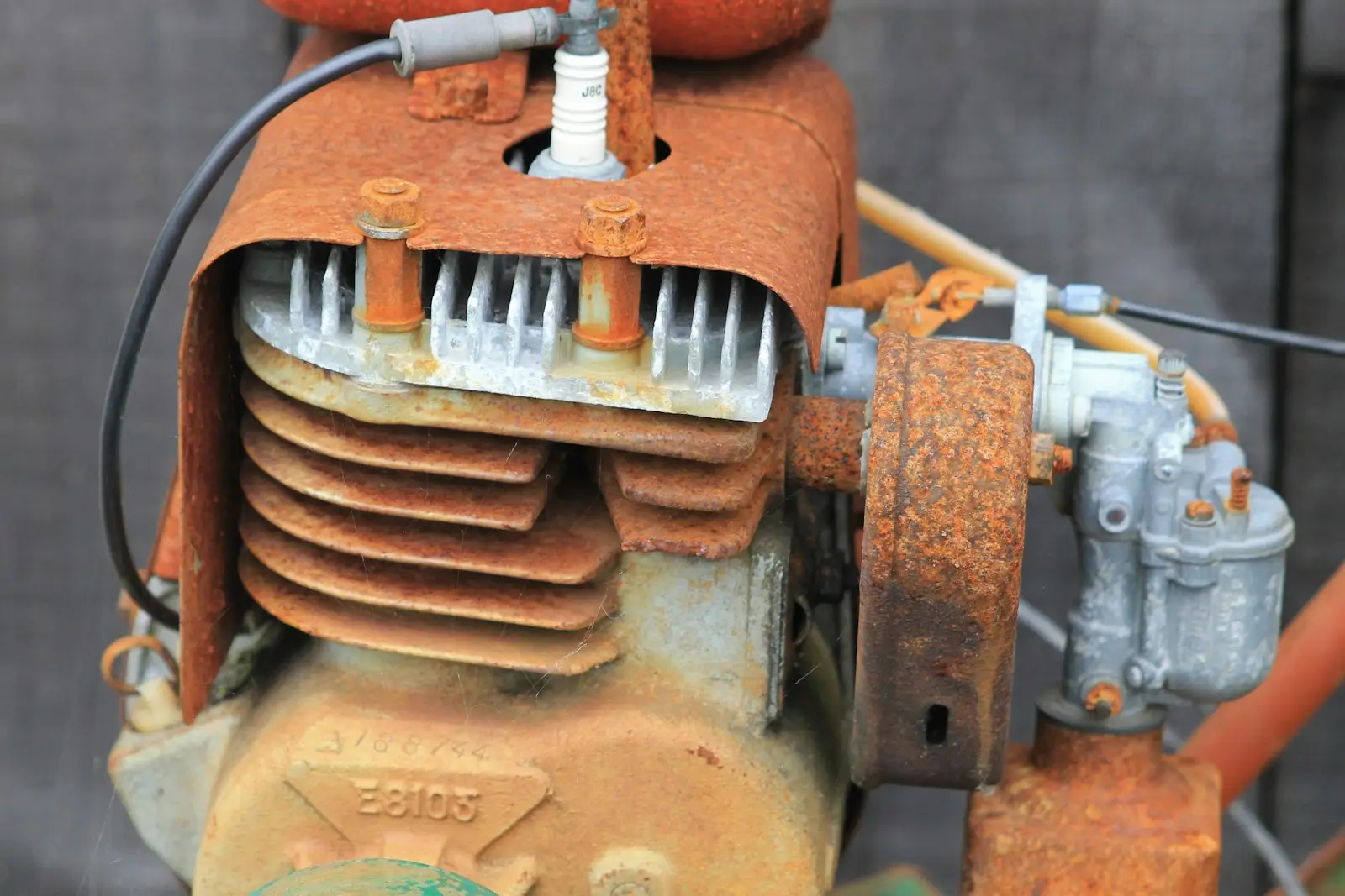 Close-up of a rusty old engine with spark plug