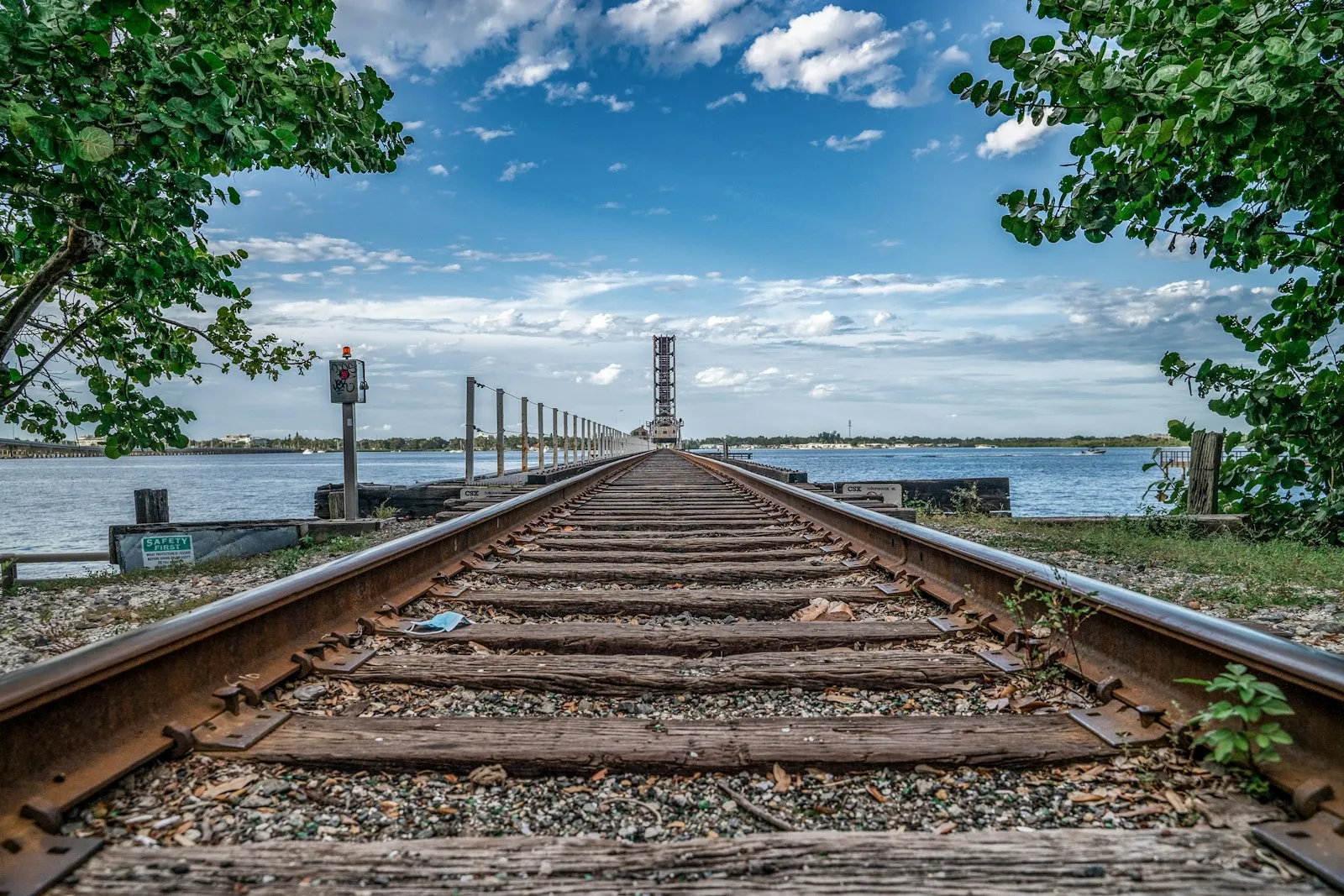 Train tracks, railroad track over the water.