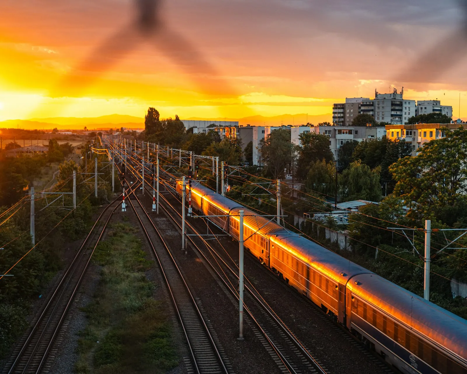 Train traveling near a city — LA County Metrolink / BNSF / UP urban rail context