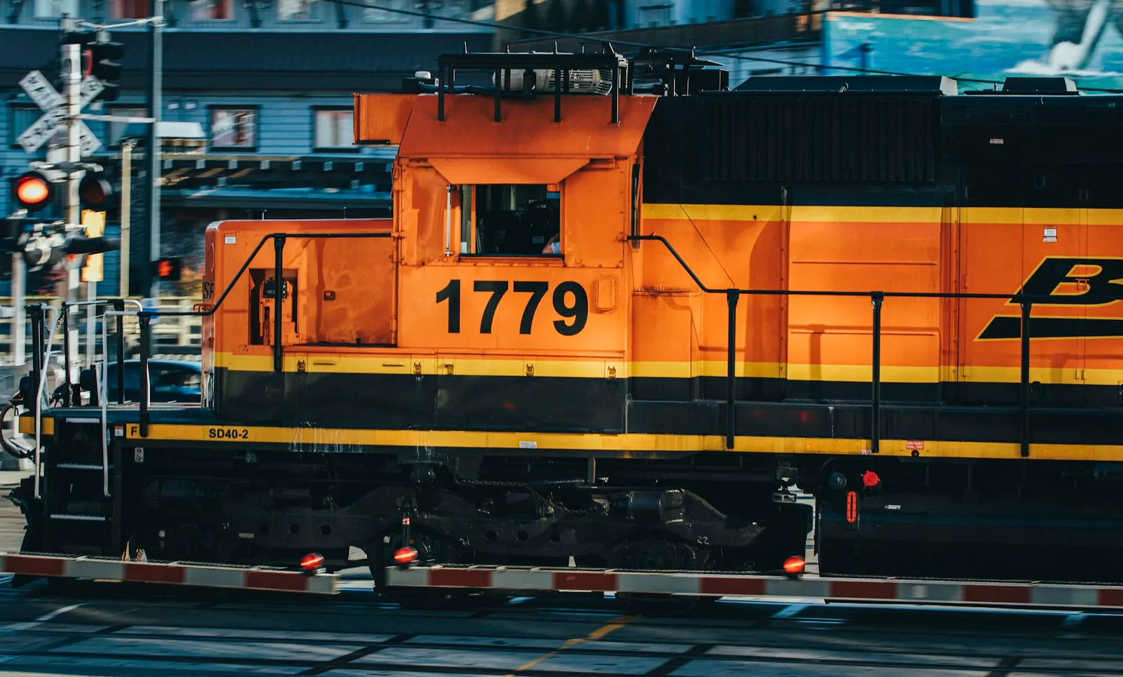 Yellow train on rail track during daytime