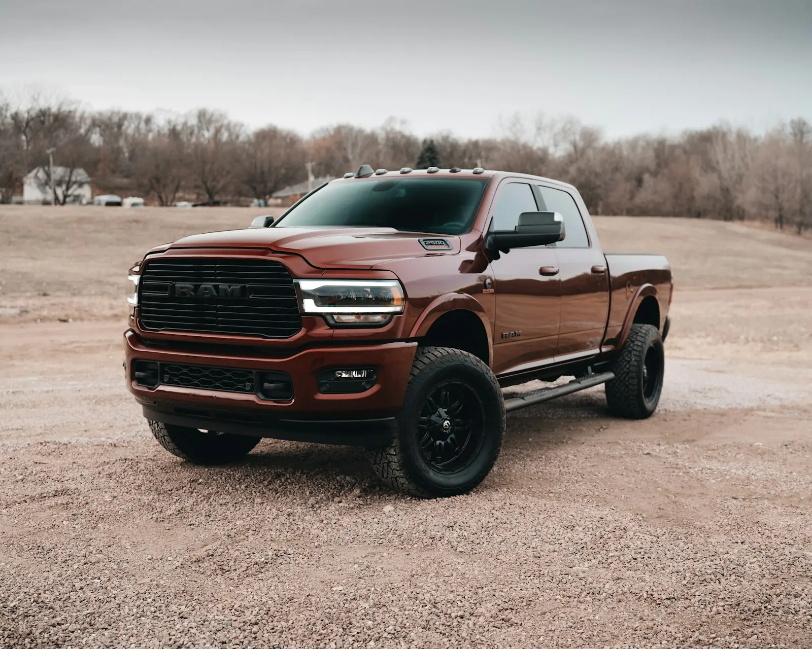 Red Chevy crew cab pickup on dirt road — the kind of pickup install the Shocker XL kit targets