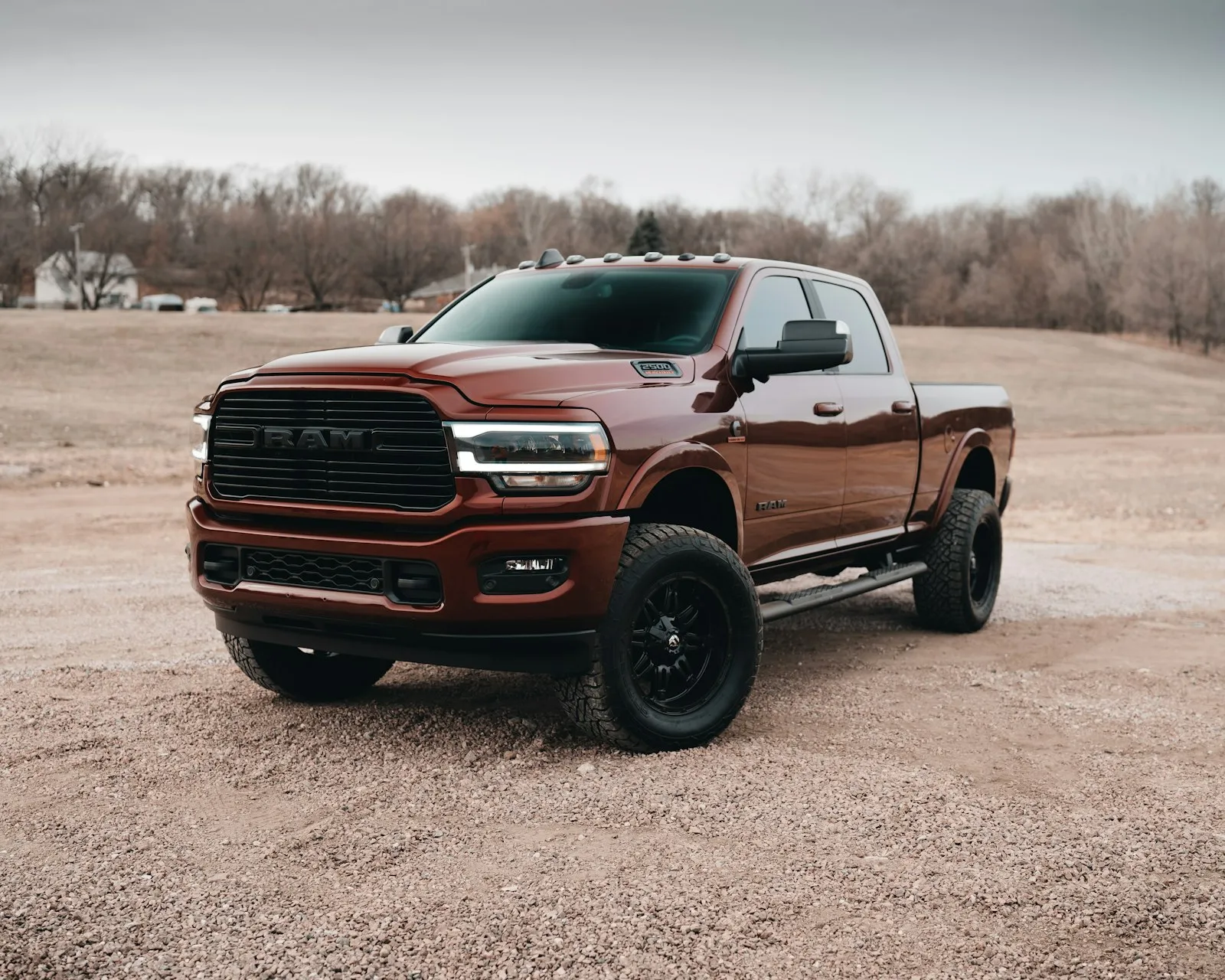 Red Chevy crew cab pickup on dirt road — the kind of pickup install the Shocker XL kit targets
