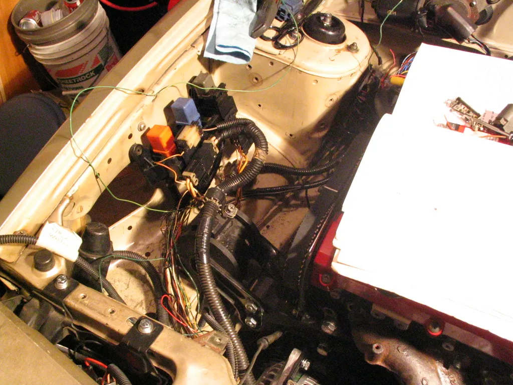 Vehicle wiring harness, relays, and control modules laid out during an electrical install