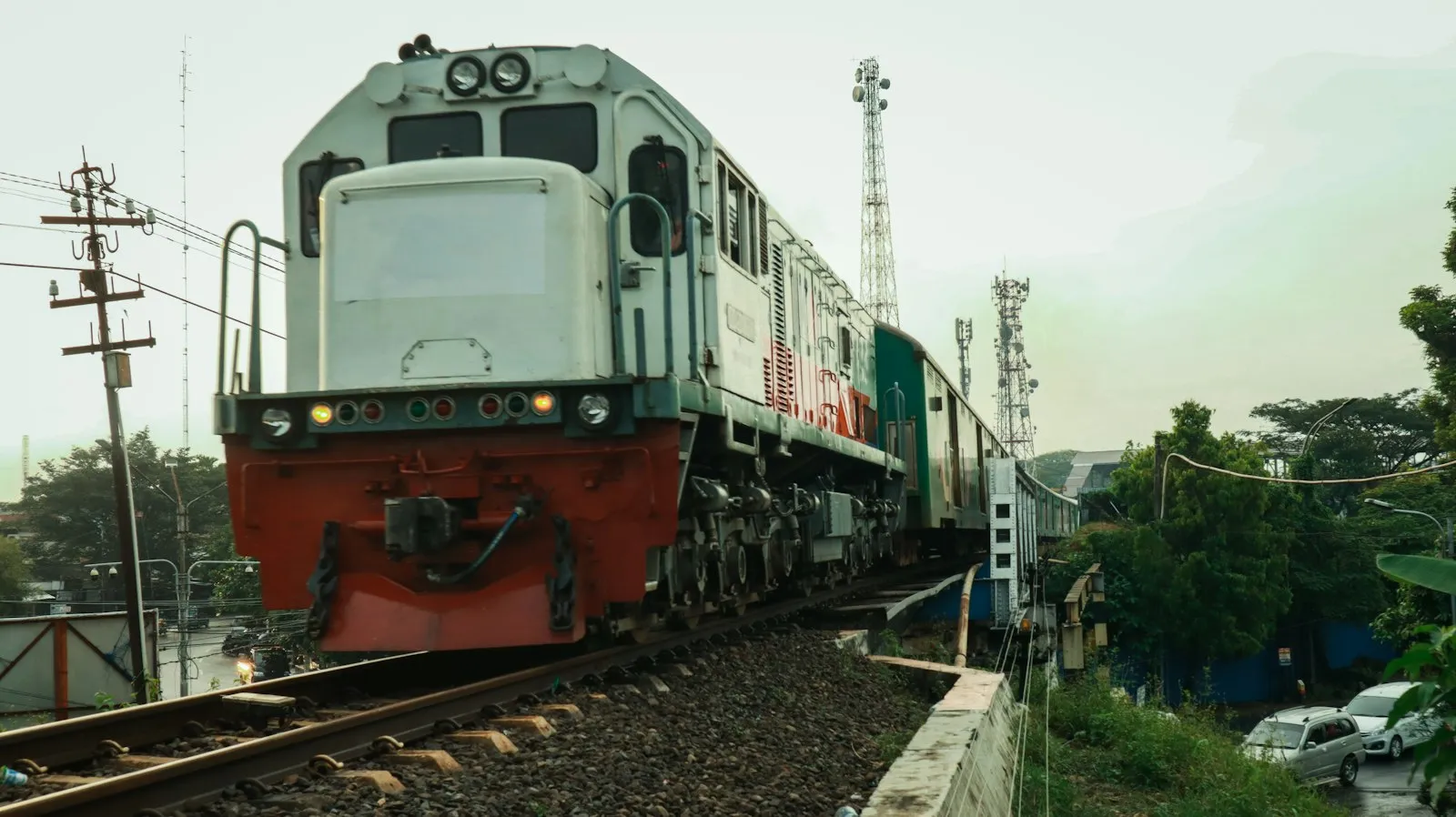 Red and white train on rail tracks during daytime