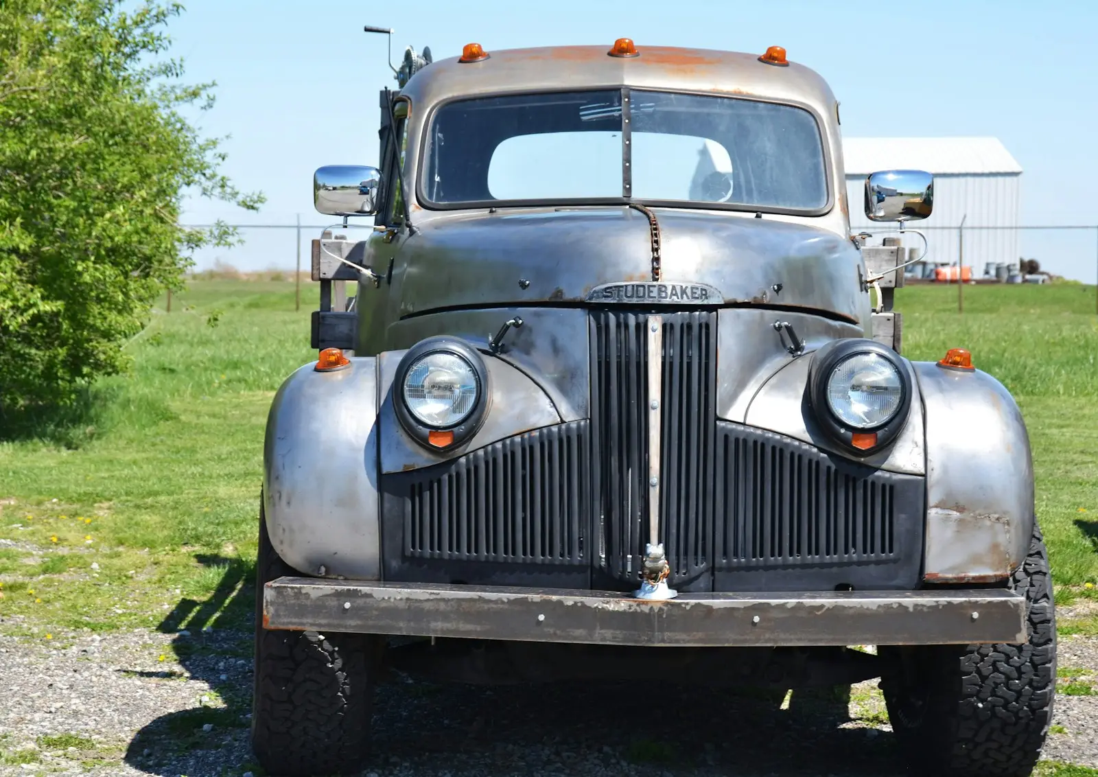 Old bare metal Studebaker flatbed truck with uh, custom touches?