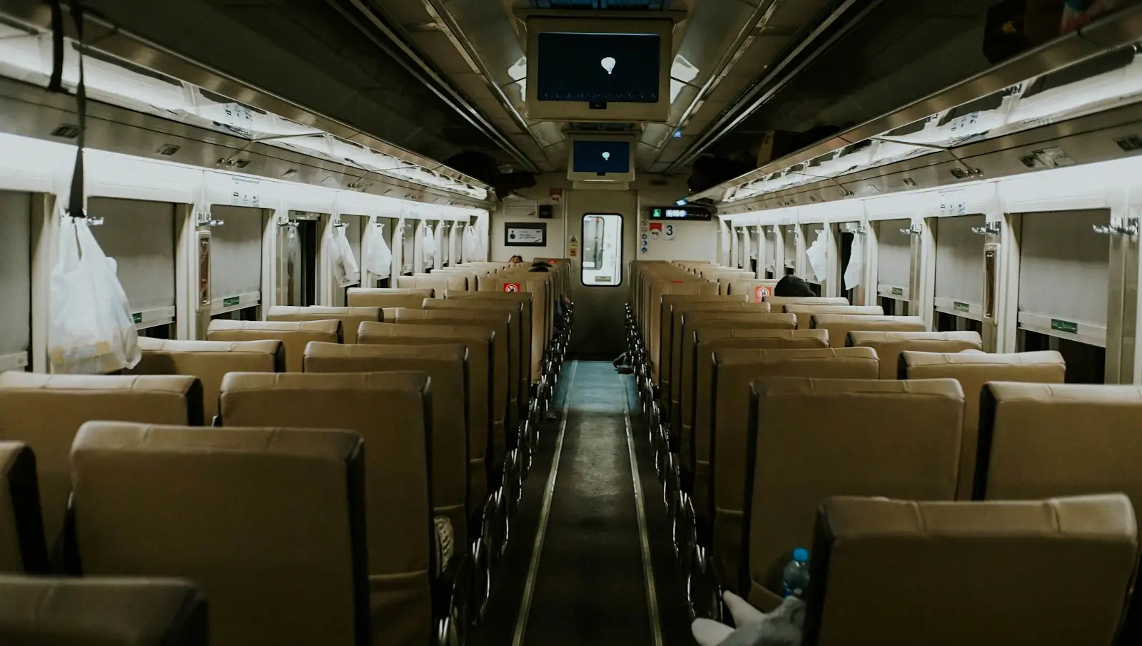 A train car filled with lots of empty seats