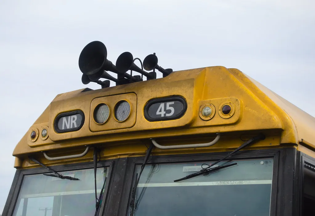 Three-chime air horn cluster mounted on the cab roof of a locomotive