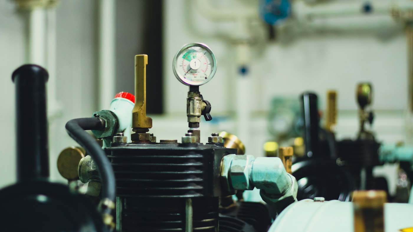 Air compressor close-up — the Viair-class compressor that fills the Conductor's 228H tank to 150 PSI