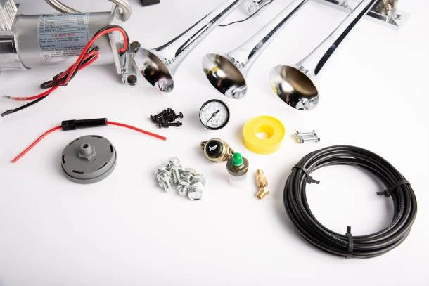 Viking Horns V101C-3/1007 kit close-up: pressure switch, 240 PSI gauge, fittings, mounting bolts, horn button, Teflon tape and coiled air line